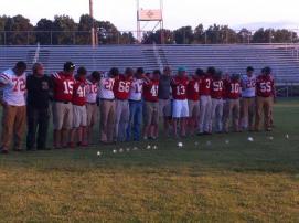 Football Team listening to "The Boys of Fall"